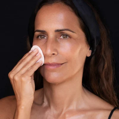Woman doing the Antiaging Face Cleansing