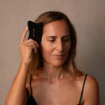 Woman Using Gua Sha Comb