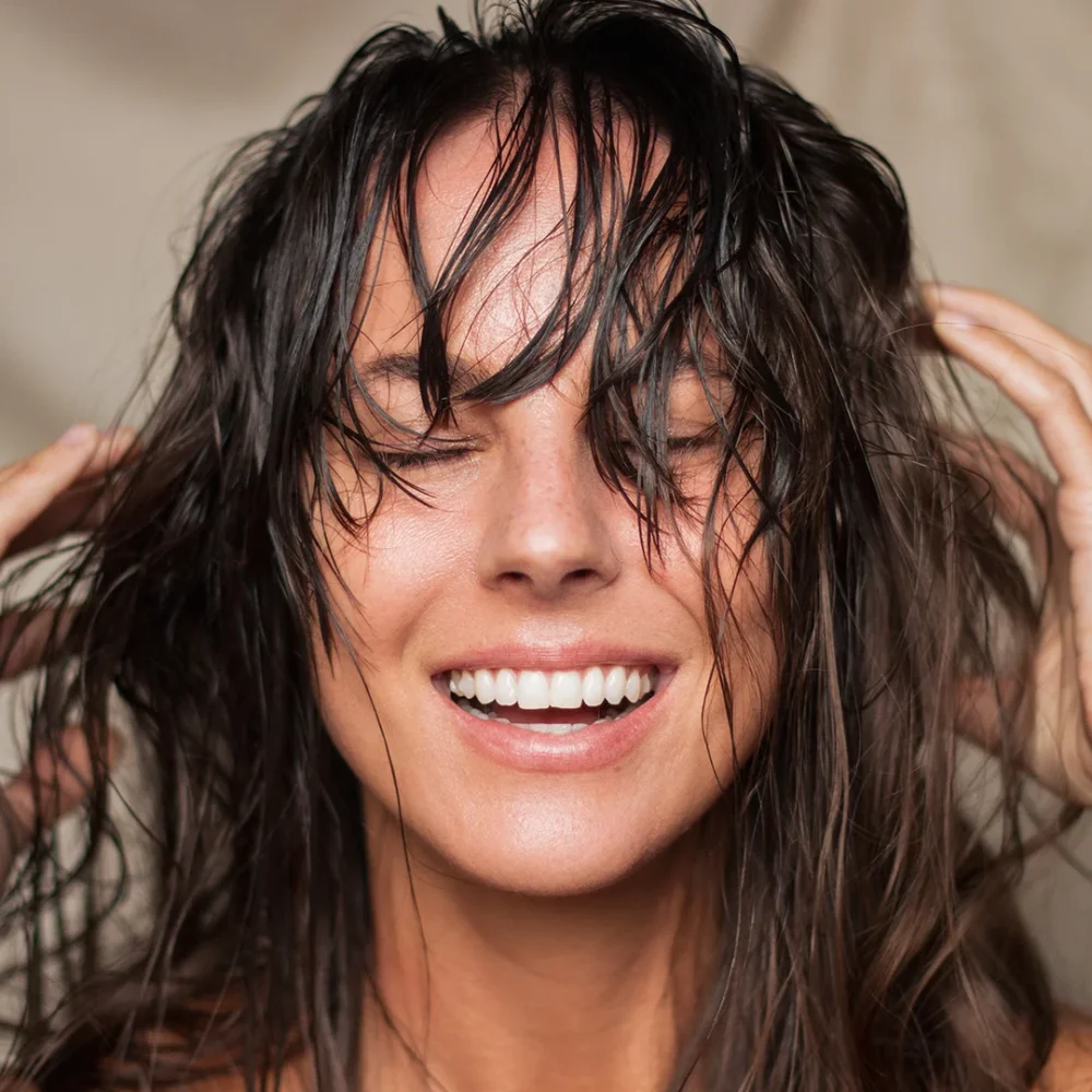 Woman with oil applied to hair