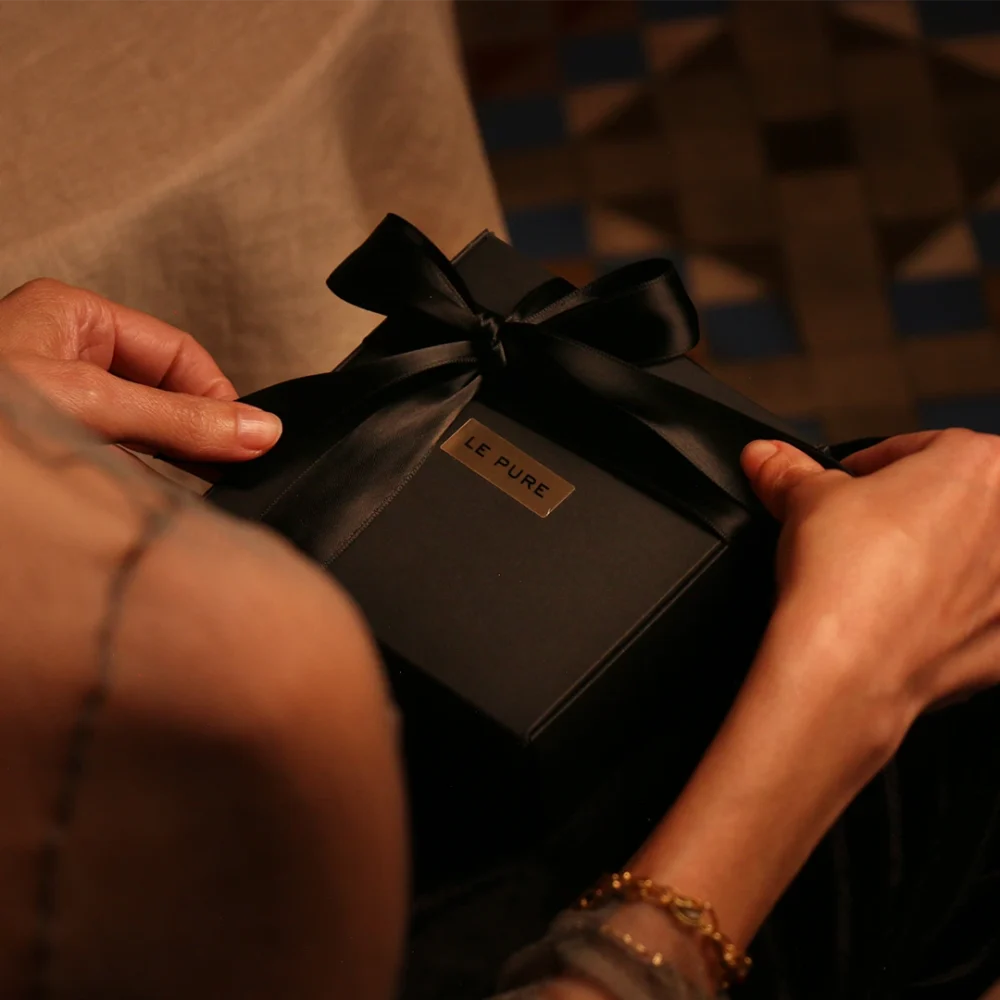 Black Christmas box with Ribbon to offer inspiring rituals as a Gift